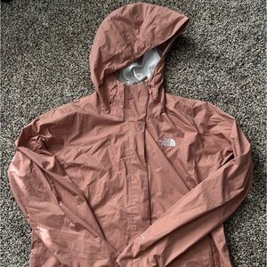 Salmon colored “The North Face” windbreaker/raincoat size Women’s Large.